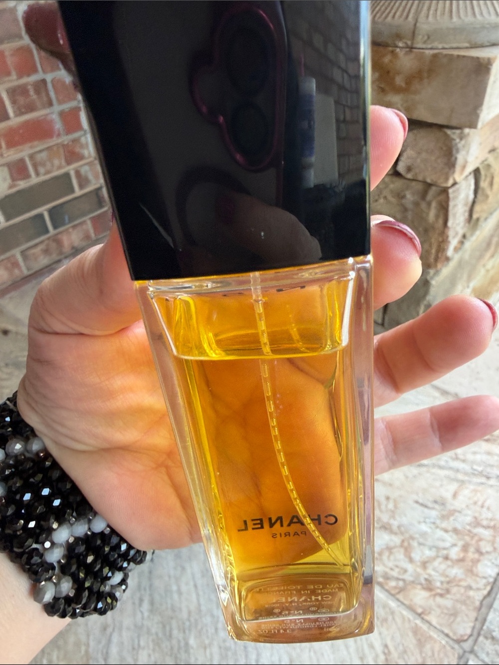 CHANEL — Clear Bottle with Black Cap and Golden Liquid - Picture 4 of 9